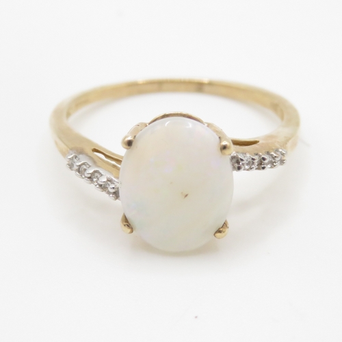 211 - 9ct gold opal and white sapphire dress ring (2.2g) Size P 1/2