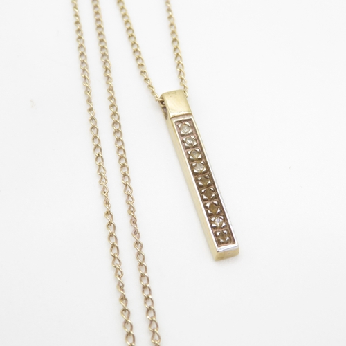 221 - 9ct gold diamond bar pendant on chain (2.2g)