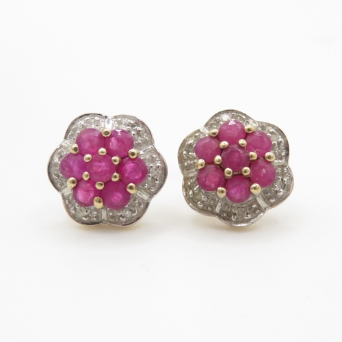 229 - 9ct gold diamond and ruby floral stud earrings (1.7g)