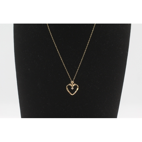 230 - 9ct gold diamond heart shape pendant necklace (1.8g)