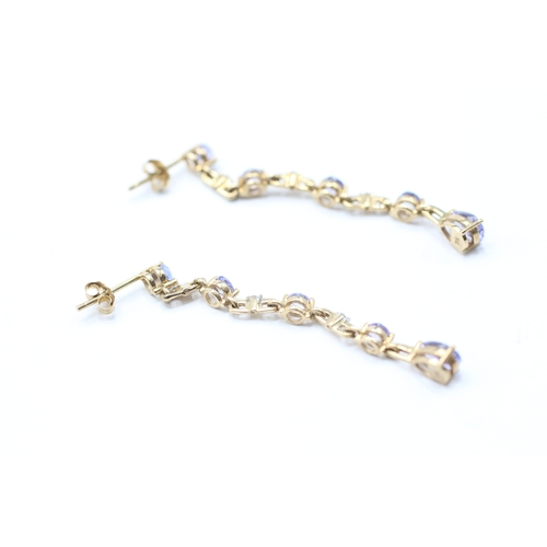 231 - 9ct gold tanzanite and diamond drop earrings (2.6g)
