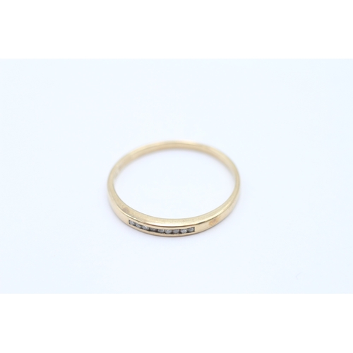 24 - 9ct gold channel set diamond ring (1.2g) Size P