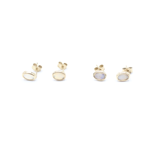 244 - 2 x 9ct gold opal stud earrings (0.8g)
