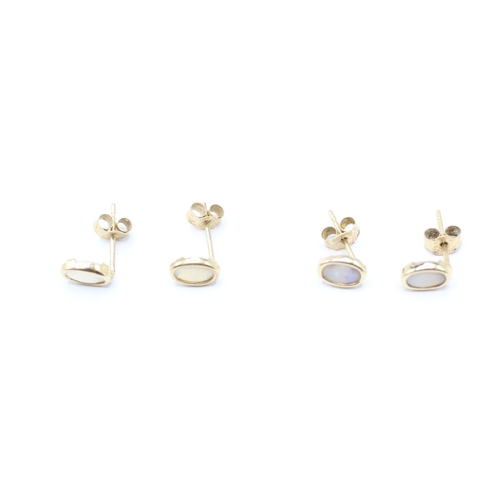 244 - 2 x 9ct gold opal stud earrings (0.8g)