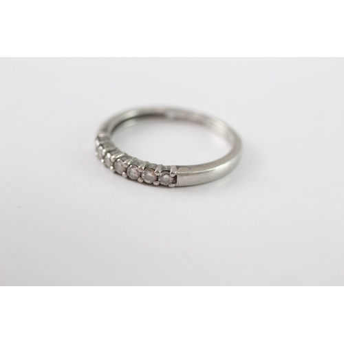 245 - .950 platinum diamond row ring (3g) Size M