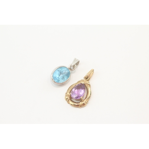 250 - 2x 9ct gold blue topaz & amethyst pendants (3.6g)