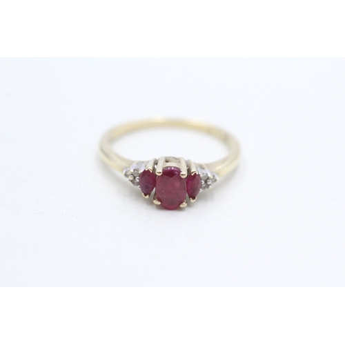 255 - 9ct gold ruby & diamond dress ring (2.1g) Size O