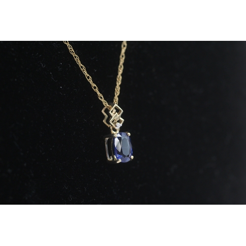 257 - 9ct gold kyanite & diamond pendant necklace (1.8g)