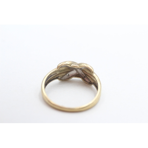 260 - 9ct gold diamond cross over ring (3.1g) Size U