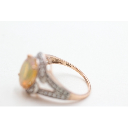 261 - 9ct gold opal & diamond dress ring (3.2g) Size P