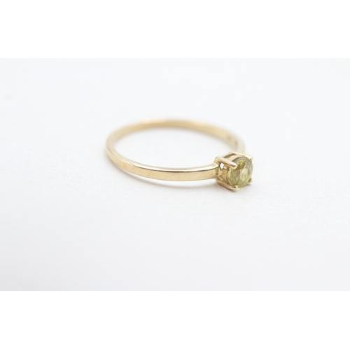 264 - 9ct gold yellow gemstone solitaire ring (1.2g) Size N 1/2