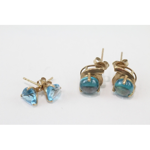 266 - 2 x 9ct gold blue topaz and blue gemstone stud earrings (3.8g)