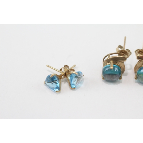 266 - 2 x 9ct gold blue topaz and blue gemstone stud earrings (3.8g)