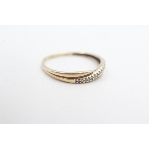 269 - 9ct gold diamond cross-over ring (1.2g) Size P