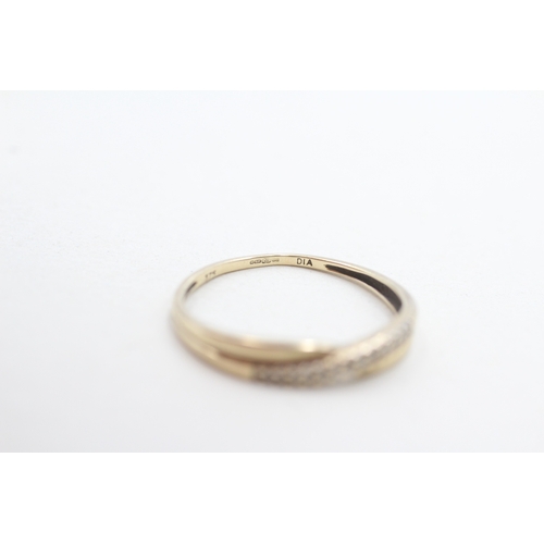 269 - 9ct gold diamond cross-over ring (1.2g) Size P
