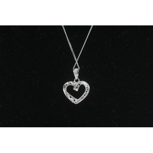 273 - 9ct gold black gemstone & diamond heart shape pendant necklace (1.7g)