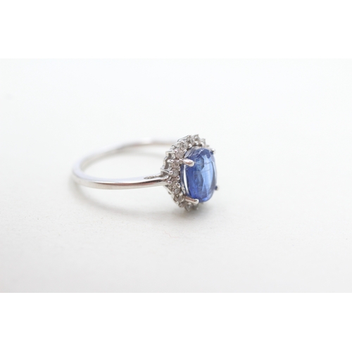 297 - 9ct gold blue & white cluster ring (2.4g) Size N