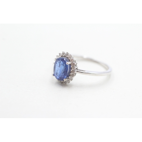 297 - 9ct gold blue & white cluster ring (2.4g) Size N