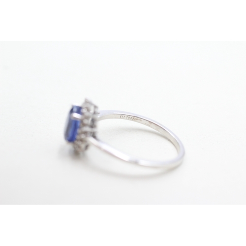 297 - 9ct gold blue & white cluster ring (2.4g) Size N