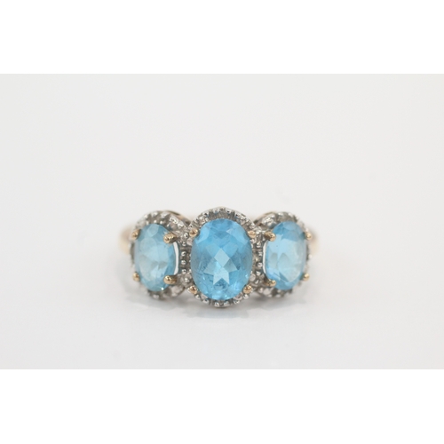 33 - 9ct gold blue topaz & diamond dress ring (4g) Size P