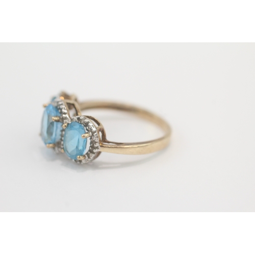 33 - 9ct gold blue topaz & diamond dress ring (4g) Size P