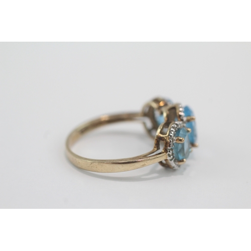 33 - 9ct gold blue topaz & diamond dress ring (4g) Size P