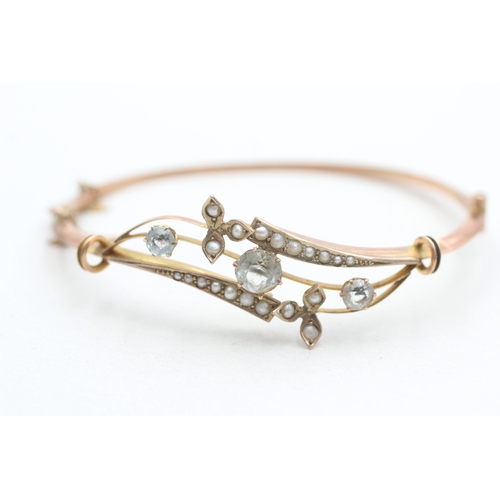 6 - 9ct rose gold antique aquamarine and seed pearl set bangle (5.8g)