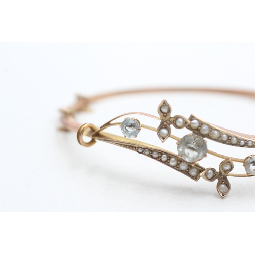 6 - 9ct rose gold antique aquamarine and seed pearl set bangle (5.8g)