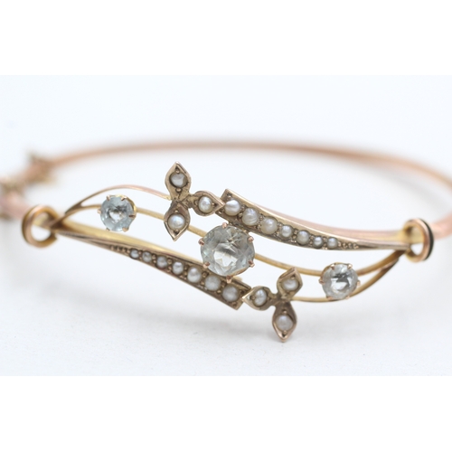 6 - 9ct rose gold antique aquamarine and seed pearl set bangle (5.8g)
