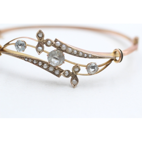 6 - 9ct rose gold antique aquamarine and seed pearl set bangle (5.8g)