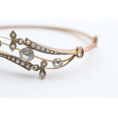 6 - 9ct rose gold antique aquamarine and seed pearl set bangle (5.8g)