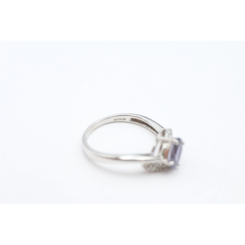 184 - 9ct white gold tanzanite and diamond crossover ring (2.4g) Size N