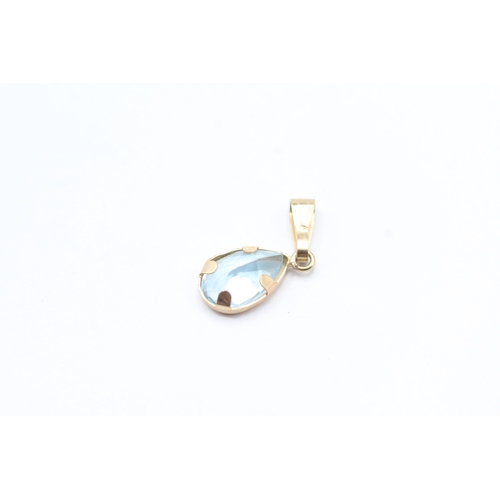 188 - 2 x 9ct gold topaz pendants (1.5g)