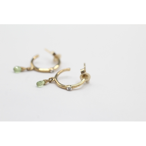 197 - 9ct gold diamond and peridot half hoop earrings (1.3g)