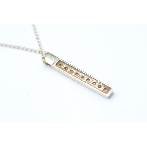 221 - 9ct gold diamond bar pendant on chain (2.2g)