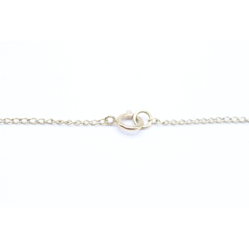 221 - 9ct gold diamond bar pendant on chain (2.2g)