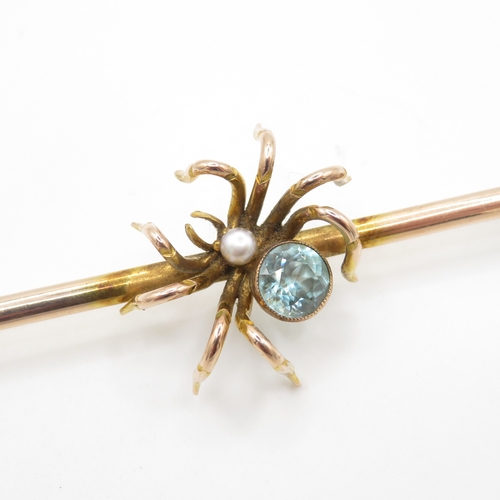 51 - 9ct gold blue gemstone spider brooch (7.5g)