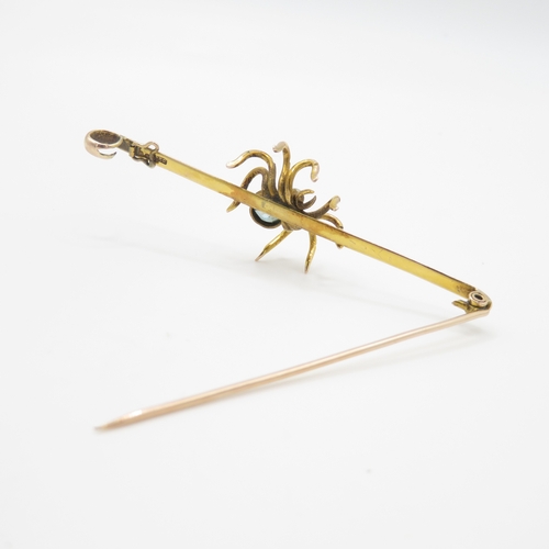 51 - 9ct gold blue gemstone spider brooch (7.5g)