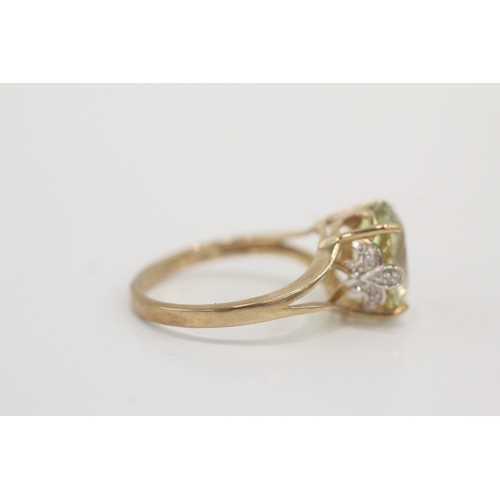 46 - 9ct gold peridot & diamond dress ring (3g) Size N