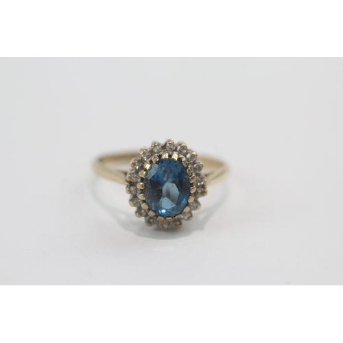47 - 9ct gold blue topaz & diamond cluster ring (2.8g) Size P
