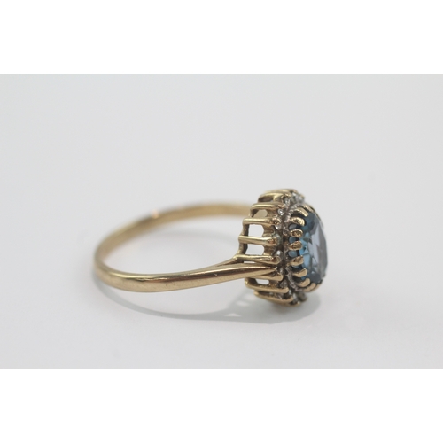 47 - 9ct gold blue topaz & diamond cluster ring (2.8g) Size P