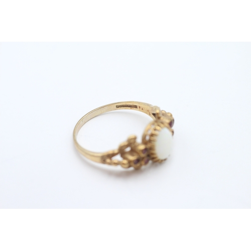 53 - 9ct gold opal and ruby dress ring (2.7g) Size P