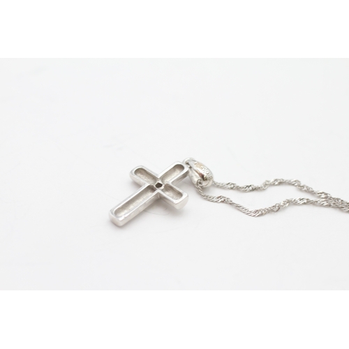 22 - 9ct white gold diamond cross pendant on chain (1.4g)