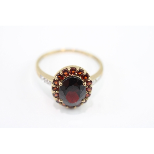 59 - 9ct gold garnet & diamond dress ring (3.1g) Size S