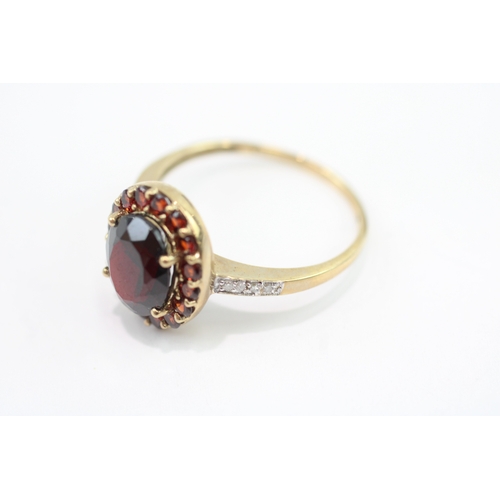 59 - 9ct gold garnet & diamond dress ring (3.1g) Size S