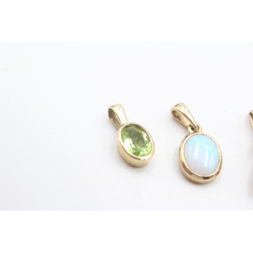 32 - 3 x 9ct gold synthetic ruby, diamond, peridot and opal pendants (2.3g)
