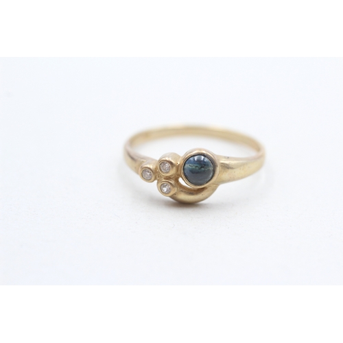 27 - 9ct gold sapphire cabochon and white gemstone dress ring (1.8g) Size O 1/2