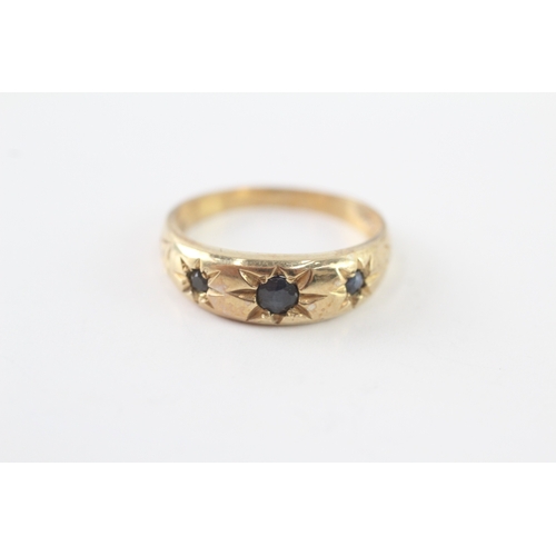 43 - 9ct gold sapphire three stone ring (2.8g) Size P