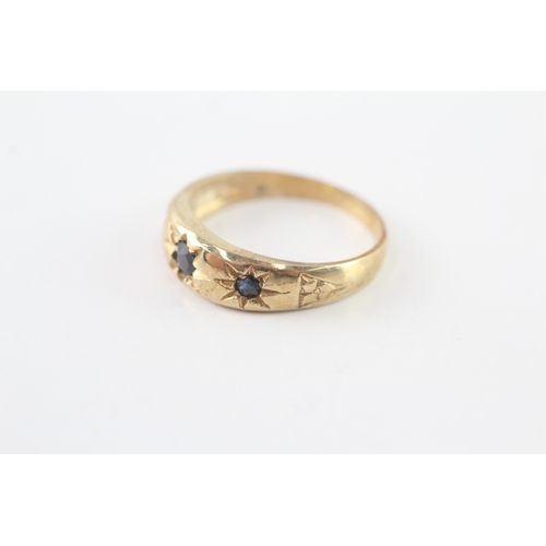 43 - 9ct gold sapphire three stone ring (2.8g) Size P
