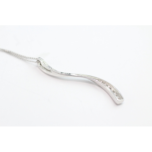 49 - 9ct white gold diamond set wave pendant necklace (1.6g)